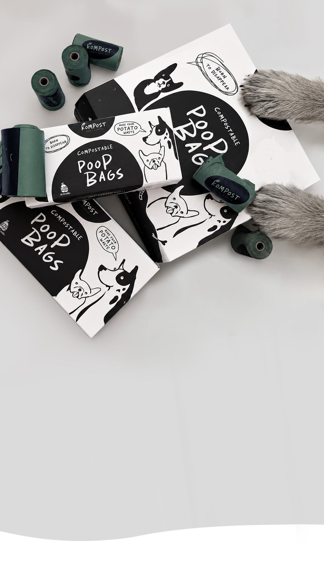 Kompost strong compostable dog poo bags made from waste potato starch and plant-based materials, with rolls and packaging for everyday dog walks.