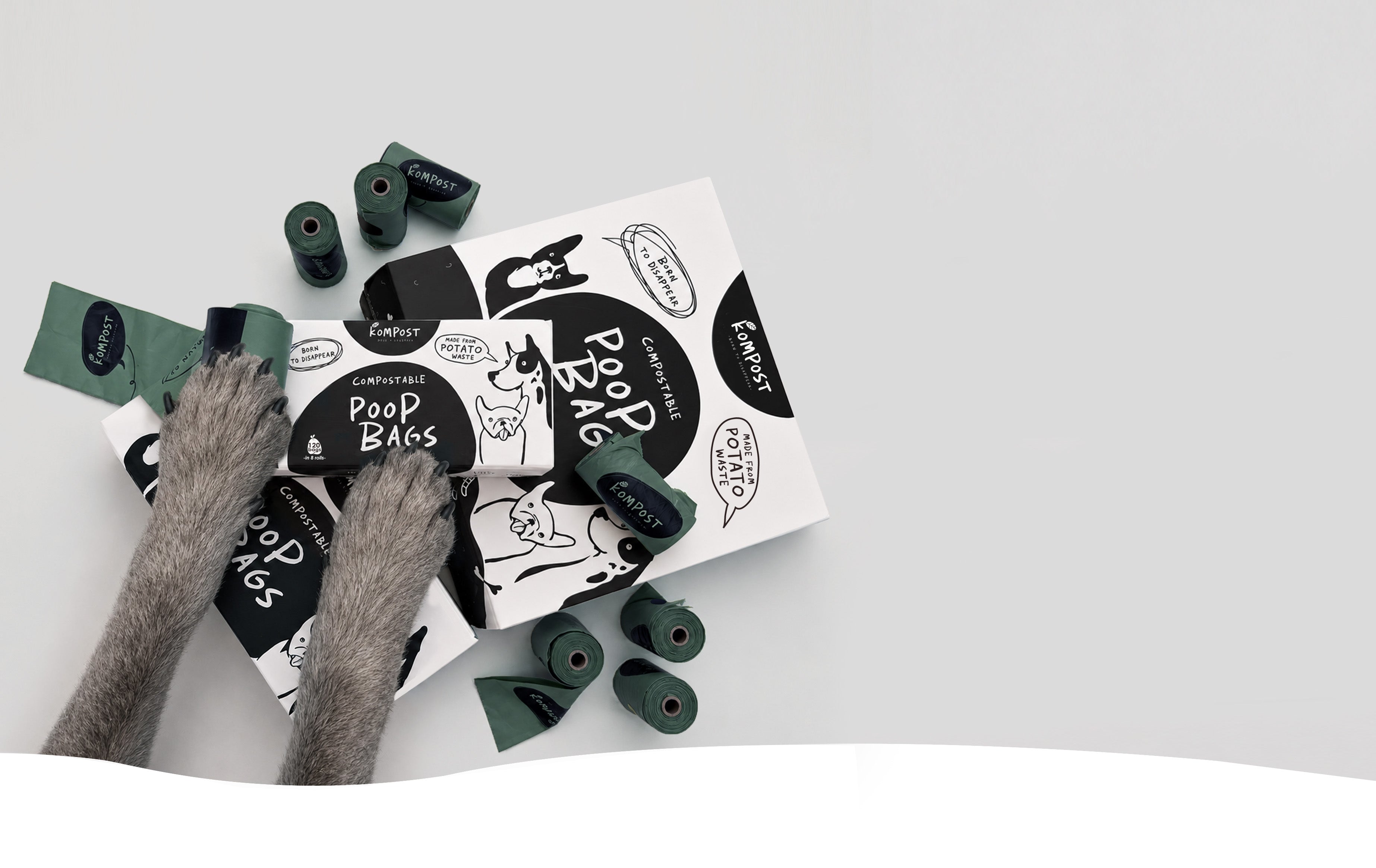 Kompost strong compostable dog poo bags made from waste potato starch and plant-based materials, with rolls and packaging for everyday dog walks.